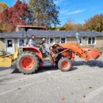 Tractor Hauling of Some of the Old Landscaping During 2022 Clean Up Day