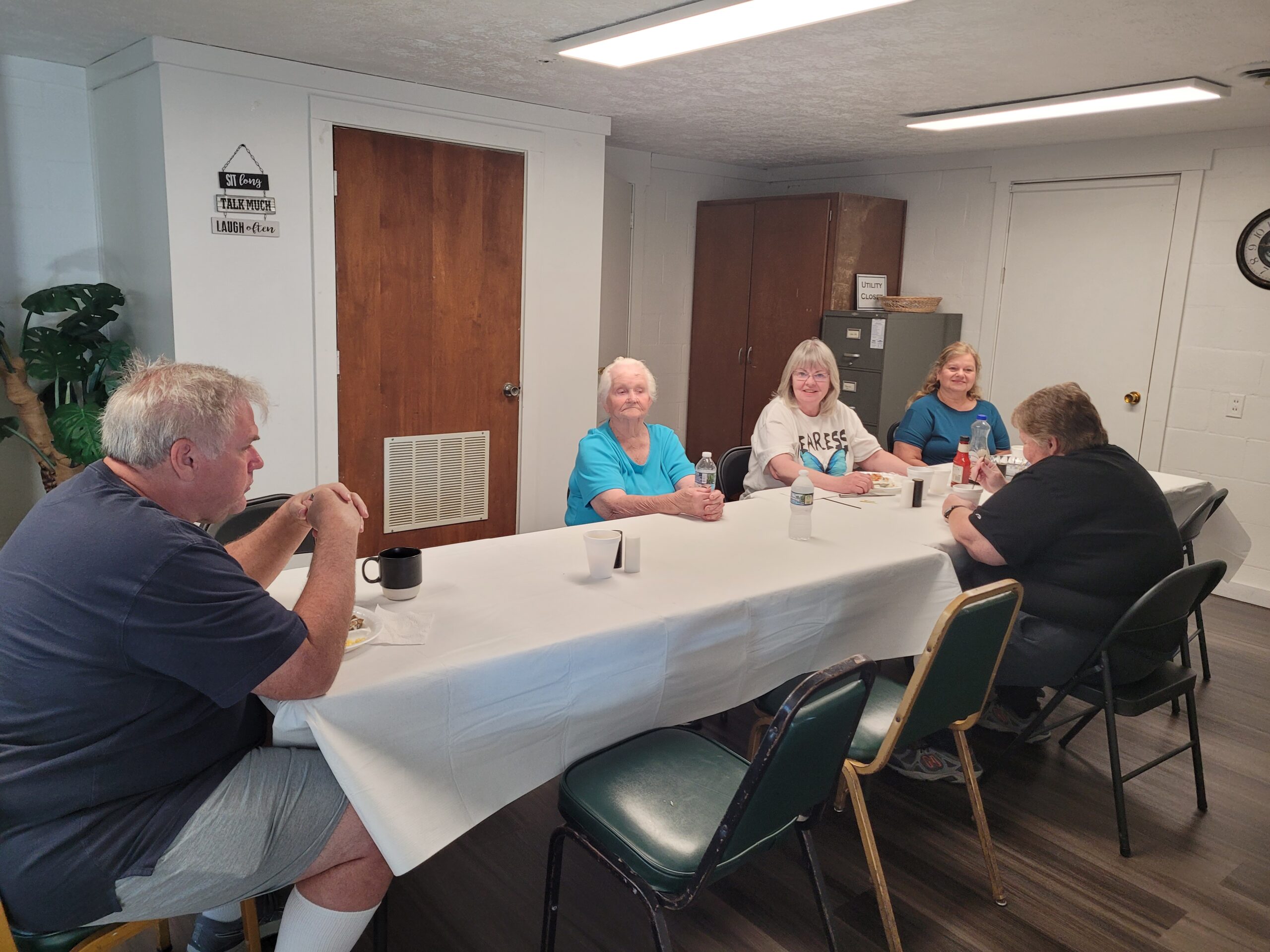 Dining room with people seated at a table